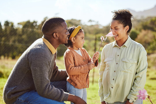 Happy Family, Countryside Fun And Child With Flower Tickle Moms Nose, Play Or Enjoy Outdoor Quality Time Together. Love, Nature Freedom And Spring Peace For Kid Girl, Parents Or Bonding Black Family