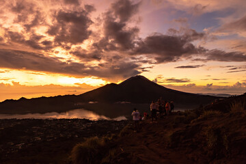 Fototapeta na wymiar Breathtaking sunrise over Abang mountain, view from Batur volcano and Batur lake, Bali, Indonesia