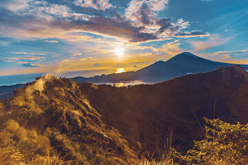 Breathtaking sunrise over Abang mountain, view from Batur volcano and Batur lake, Bali, Indonesia