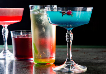 Cocktails glasses assortment served on dark background