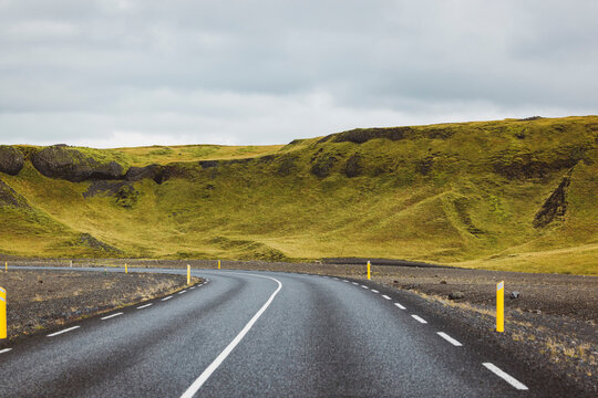 Traveling trough Iceland - winding road volcanic landscape