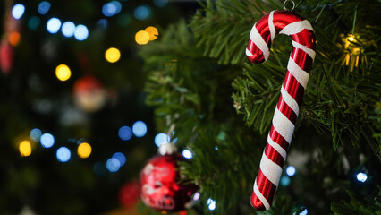 Decorated Christmas tree on blurred background.         