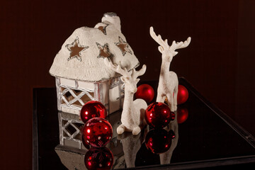 colorful image for decorative purposes on a dark background and reflecting surface. xmas decoration. Closeup. xmas background. Xmas. Accessories.