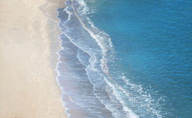 multiple exposure of waves flowing into a beach with copy space