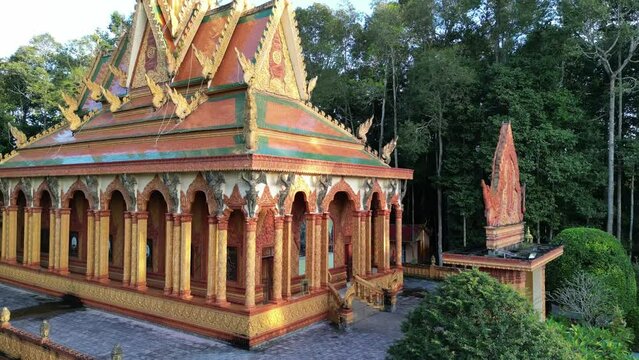 Ascending drone footage along a Khmer pagoda, Wat Koskeoserey in Tra Vinh province, south Vietnam. Beautufil architecture well preserved in great environment.