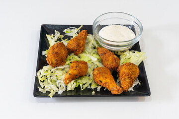 Kebab restaurant chef, traditional turkish and arabic food, chicken wings on a white background