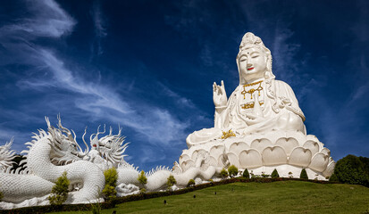 The immense white female Buddha at the Temple of Mercy (Guanyin) in Chiang Mai is easily recognizable as it dominates the landscape at 90 meters, or 26 stories high..
