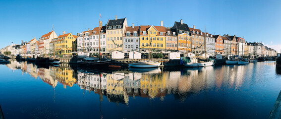 Fototapeta na wymiar Nyhavn in Copenhagen. Panorama od the port in center of Copenhagen.