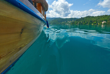 Wooden boat in Bled lake waters, Slovenia