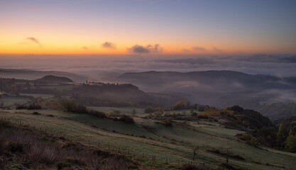 Landscape France Ardeche at Privas Creysseilles at dawn before sunrise with fog and clouds in the valleys