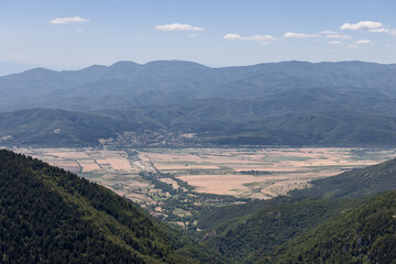 Aerial panoramic view from the Balkans on the valley of the Tundzha River which stretches from west to east and is known as famous Rose Valley, and mountain massif Srednaya Gora behind it, Bulgaria