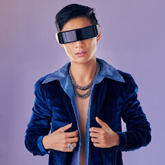 Asian, man and vr with future glasses in studio for aesthetic, jewelry or cyberpunk by lavender...