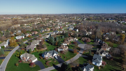 New development two story houses in subdivision sprawl with cul-de-sac and low-density residential...