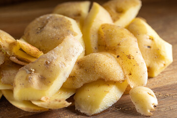 Pile of potatoes peel or skin on wood