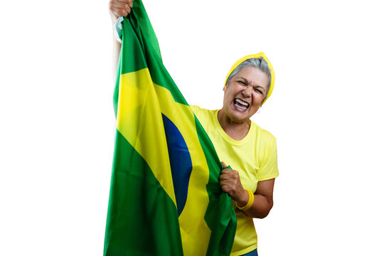 Senior Woman with Gray Hair, yellow Shirt Holding Brazil Flag Isolated.