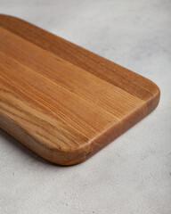 Wooden cutting board in the kitchen on a light background