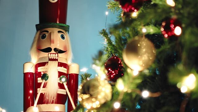 Toy Nutcracker Near the Christmas tree