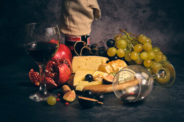 still life wine different cheeses and fruits