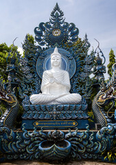 Wat Rong Suea Ten, better known as The Blue Temple, is located in Chiang Rai, a four-hour drive north of Chiang Mai. The temple statues and walls are decorated in a brilliant blue hue of sapphire.