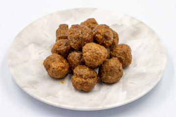 Baked homemade meatballs on a white background. Local name misket kofte. close up