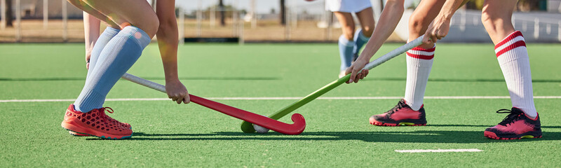 Fitness, sports and hockey with women on field and training for competition, challenge and workout. Battle, games and exercise with shoes of hockey player and sticks in stadium for workout and health