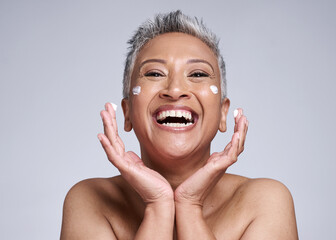 Face, cream and happy senior portrait of woman with luxury dermatology product dots and playful...