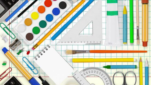 Horizontal composition of colorful school supplies moving upwnwards on squared paper background. School and Education concept. Seamless looping. High quality 4k video.