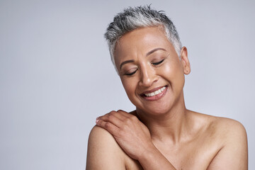Skincare, face and senior woman with eyes closed in studio on a gray background mockup. Makeup,...