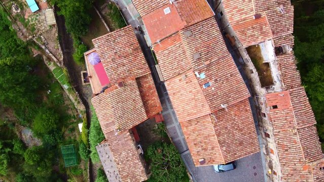 Flying over some typical little streets in Castellfollit de la Roca, typical village in Catalonia, Spain