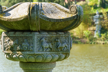 stone carving engravings at the he'd of a symbolic column

