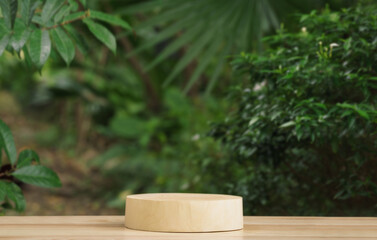 empty top table pine wood podium texture in tropical outdoor garden green plant blur background...