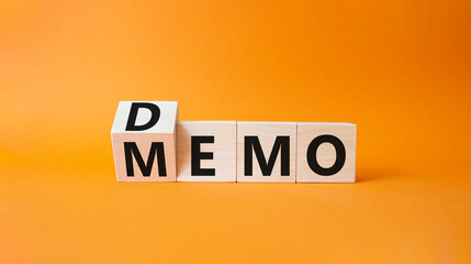 Demo and Memo symbol. Wooden cubes with words Memo and Demo. Beautiful orange background. Business and Demo and Memo concept. Copy space.