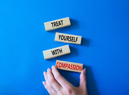 Treat Yourself With Compassion Symbol. Concept Words Treat Yourself With Compassion On Wooden Blocks. Beautiful Blue Background. Doctor Hand. Medicine Concept. Copy Space.