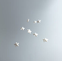 Creative winter scene with white stars. Sunny day concept. Minimal top view.