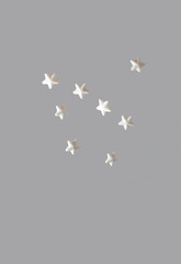Creative winter scene with white stars. Sunny day concept. Minimal top view.