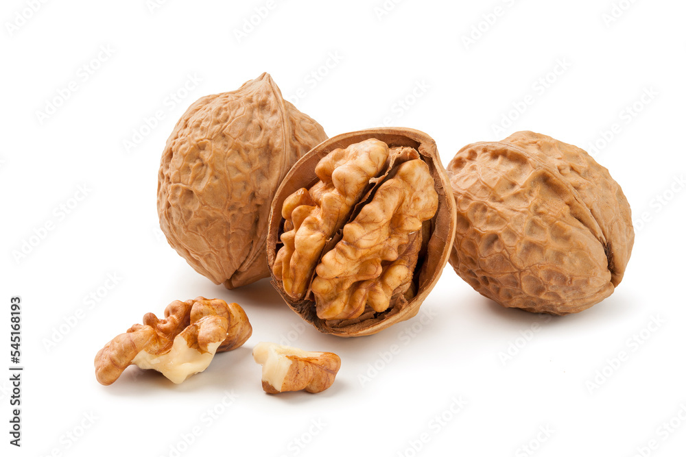 Wall mural walnuts peeled with kernels on white background.