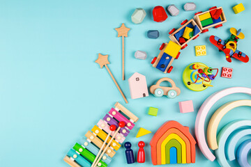 Baby Kids Toys On Light Blue Background. Colorful Educational Wooden And Musical Toys. Top View