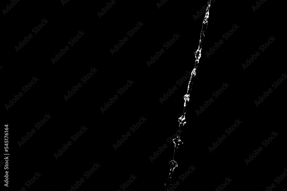 Poster water splashes isolated on black background. white jets with drops
