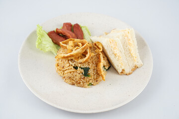 slice of bread with fried rice and egg