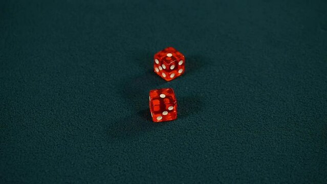 Rolling two red dice and getting same numbers one on both - Snake Eyes, Slow motion 