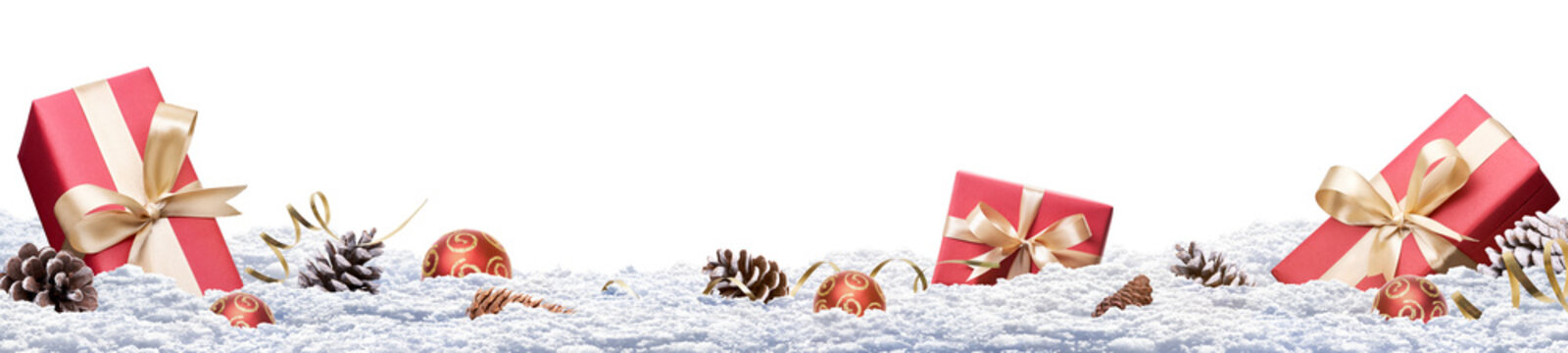 A festive Christmas banner of a winter landscape with presents and decorations in the snow isolated against a transparent background.