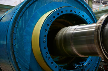 Blue ball mill grinds mineral materials at factory closeup - obrazy, fototapety, plakaty