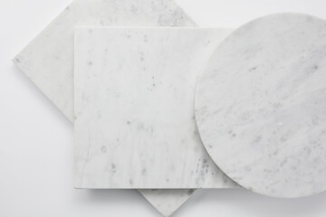 White gray empty marble boards of various shapes. Square and round marble slabs. Flat lay