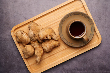 Top view of ginger tea on wooden background.