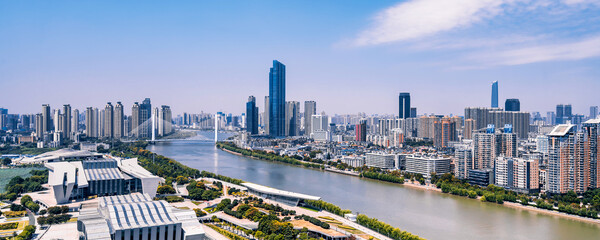 Sunny day scenery of Qintai Grand Theater and Han River in Wuhan, Hubei, China