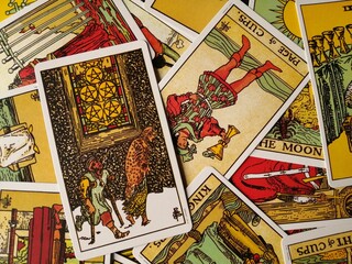 Picture of the Five of Pentacles tarot card from the original Rider Waite tarot deck with mixed...