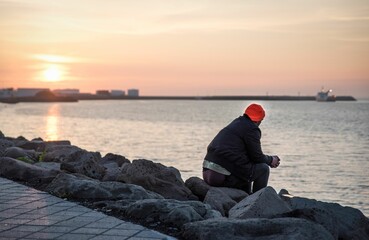 Person by the lake in Reykjavik, Iceland