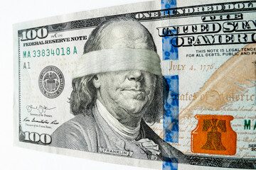 This photo illustration of Ben Franklin wearing a blindfold on a hundred dollar bill might illustrate a misguided economy, leadership issues, inflation, economic recession, or budget cuts etc. - 545201973