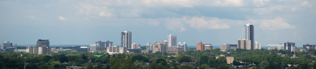 panoramic skyline of Kitchener, Ontario, Canada with fall colored trees and several buildings  - obrazy, fototapety, plakaty
