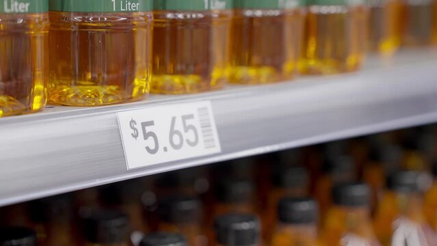 Rising prices cost of living interest rate tax raise crisis concept. Global CPI index data number surge up high in grocer market by cooking oil food supply chain issues at retail store grocery mall.